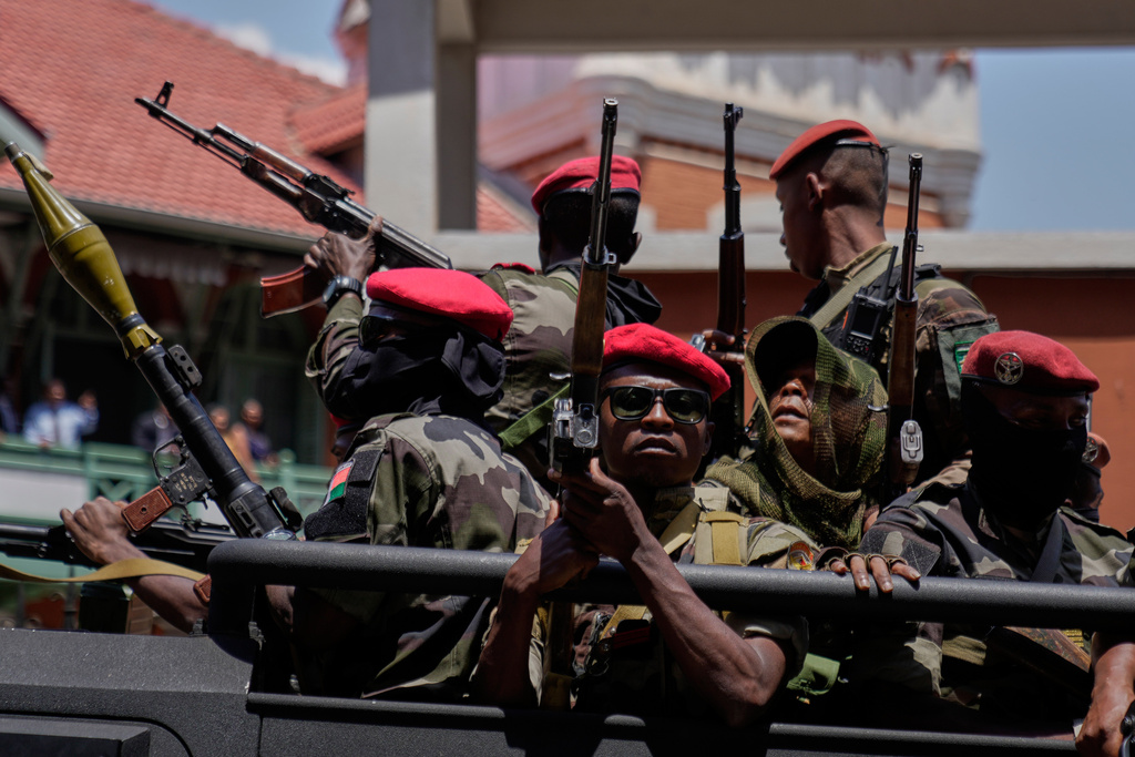 Soldiers loyal to Col. Michael Randrianirina guard the entrance of the high constitutional court in Antananarivo, Madagascar, Friday, Oct. 17, 2025. (AP Photo/Brian Inganga)
