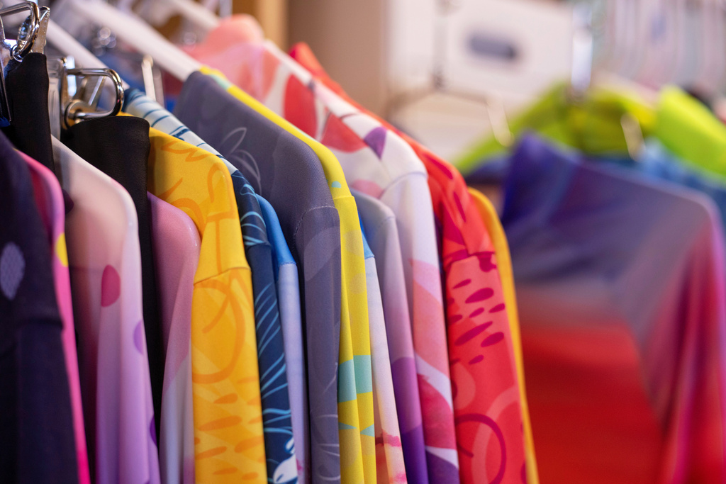 Terry Precision Cycling bike shirts hang on a rack at the company’s headquarters in Burlington, Vt., on Tuesday, Oct. 28, 2025. (AP Photo/Amanda Swinhart)