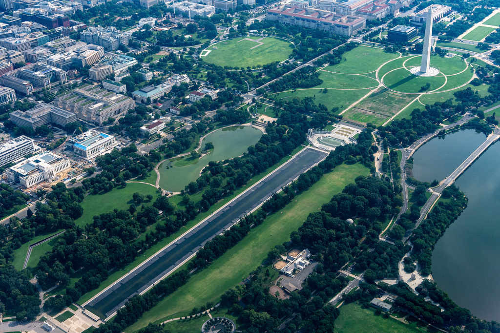 The Washington Monument, top right, the White House, top center left, and Lincoln Memorial Reflecting Pool, center, are seen from the air, Sunday, Aug. 9, 2026, in Washington. (AP Photo/Alex Brandon)