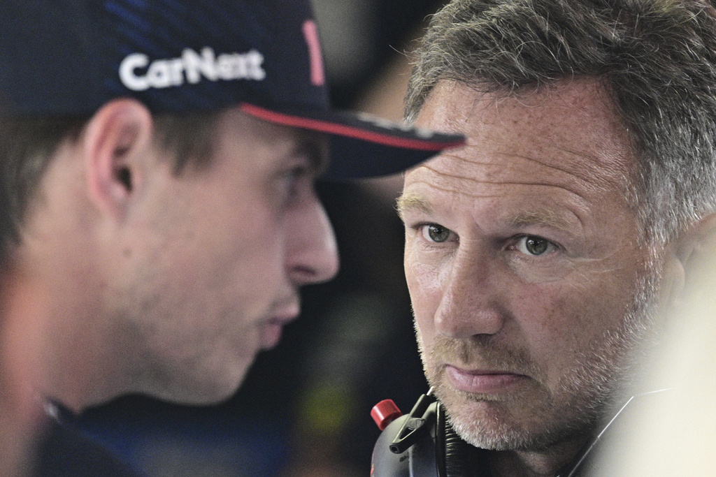 FILE - Red Bull team principal Christian Horner, right, talks to Red Bull driver Max Verstappen of the Netherlands before the qualifying session ahead of Sunday's Formula One Italian Grand Prix auto race, at the Monza racetrack, in Monza, Italy, Sept. 2, 2023. (Christian Bruna/Pool via AP File)