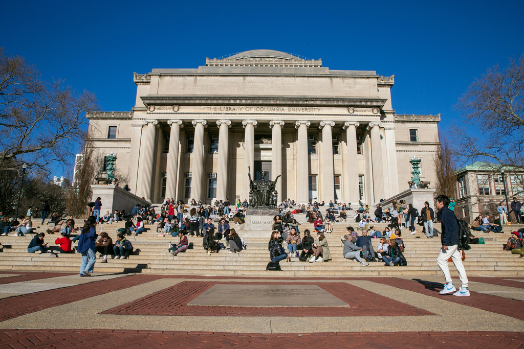 FILE - Students relax on the front steps of Low Memorial Library on the Columbia University campus, in New York City, Feb. 10, 2023. (AP Photo/Ted Shaffrey, File)