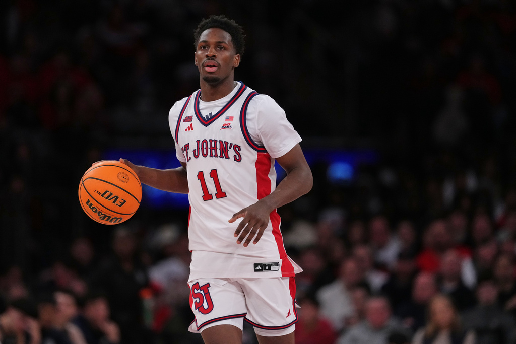 St. John's Red Storm's Ian Jackson (11) looks to pass during the second half of an NCAA college basketball game against the Georgetown Hoyas Tuesday, March 3, 2026, in New York. (AP Photo/Frank Franklin II)