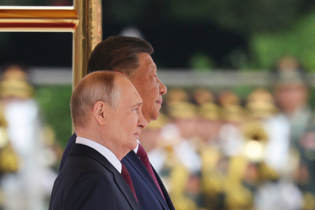 Russian President Vladimir Putin, foreground and Chinese President Xi Jinping attend a welcoming ceremony at the Great Hall of the People in Beijing Wednesday, May 20, 2026. (Maxim Shemetov/Pool Photo via AP)