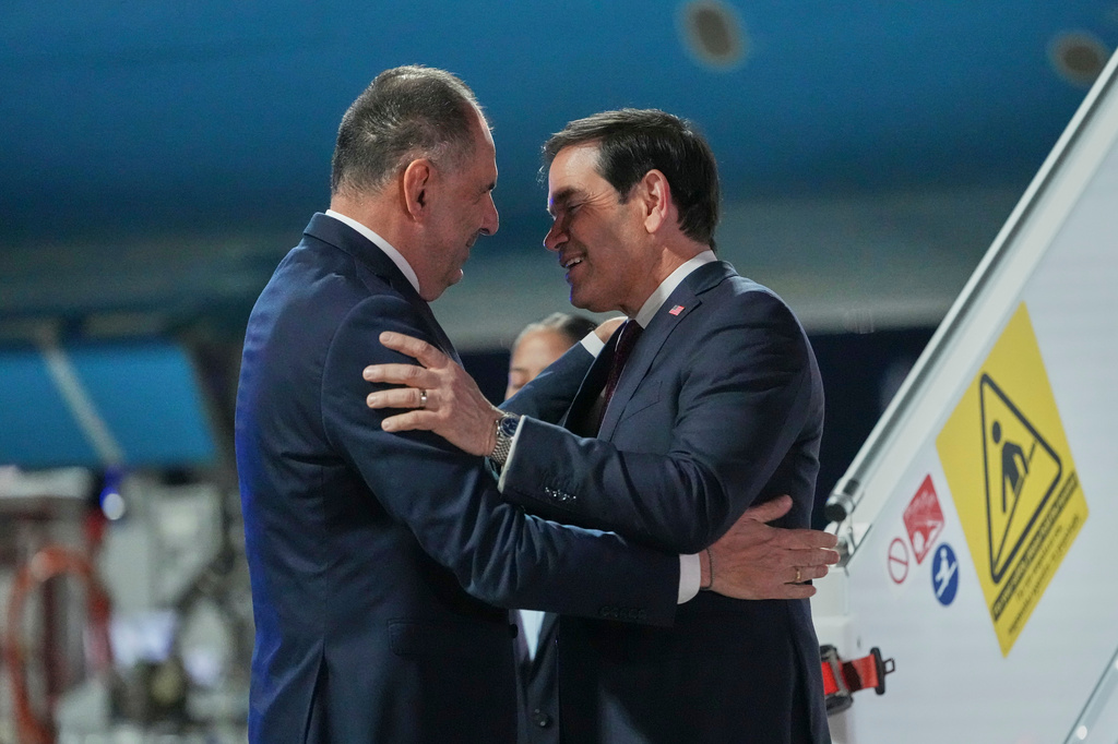 Greek Foreign Minister George Gerapetritis welcomes U.S. Secretary of State Marco Rubio, right, upon his arrival at Eleftherios Venizelos International Airport near Athens, Greece, Tuesday, Oct. 6, 2026. (AP Photo/Mark Schiefelbein, Pool)