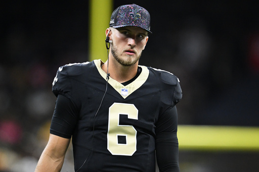 New Orleans Saints quarterback Tyler Shough watches from the sideline during the first half of an NFL football game against the New England Patriots, Sunday, Oct. 12, 2025, in New Orleans. (AP Photo/Ella Hall) New Orleans Saints quarterback Tyler Shough watches from the sideline during the first half of an NFL football game against the New England Patriots, Sunday, Oct. 12, 2025, in New Orleans. (AP Photo/Ella Hall)