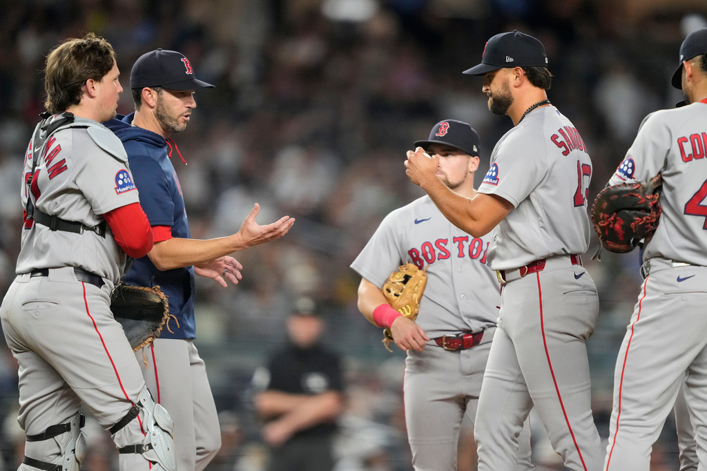 Boston Red Sox pitcher Patrick Sandoval heads to the dugout while being pulled by Boston Red Sox manager Chad Tracy during the sixth inning of a baseball game against the New York Yankees, Friday, Aug. 28, 2026, in New York. (AP Photo/Yuki Iwamura)