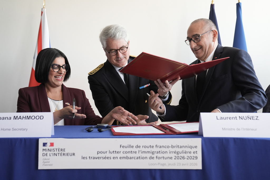 Britain's Home Secretary Shabana Mahmood, left, signs an agreement with France's Interior Minister Laurent Nunez during her visit in Dunkirk, France, Thursday April 23, 2026. (Stefan Rousseau/Pool Photo via AP)