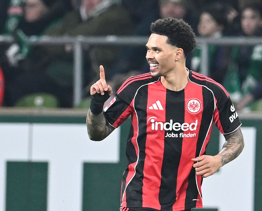 Eintracht Frankfurt's Nnamdi Collins celebrates after scoring his side's second goal during the German Bundesliga soccer match between Werder Bremen and Eintracht Frankfurt, in Bremen, Germany, Friday, Jan. 16, 2026. (dpa via AP)