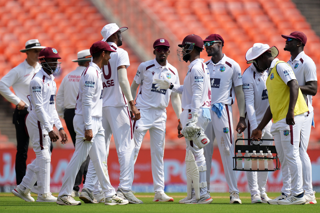 West Indies' players celebrate the dismissal of India's captain Shubman Gill on the second day of the first Test cricket match between India and West Indies at Narendra Modi Stadium in Ahmedabad, India, Friday, Oct. 3, 2025. (AP Photo/Ajit Solanki)