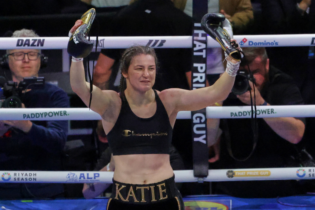 Ireland's Katie Taylor celebrates after beating Flora Pili of France in their super lightweight world title fight in Dublin, Saturday, Sept. 5, 2026. (AP Photo/Peter Morrison)