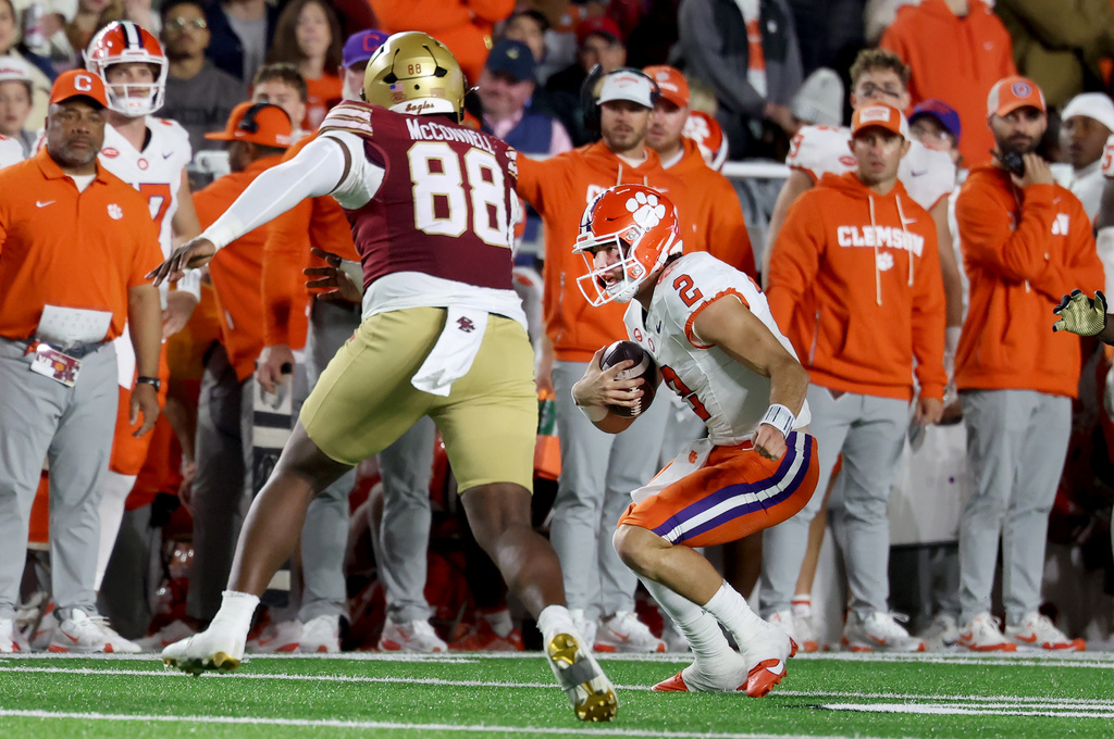 Clemson quarterback Cade Klubnik (2) runs the ball past Boston College defensive lineman Sedarius McConnell (88) during the second half of an NCAA college football game Saturday, Oct. 11, 2025 in Boston. (AP Photo/Mark Stockwell)