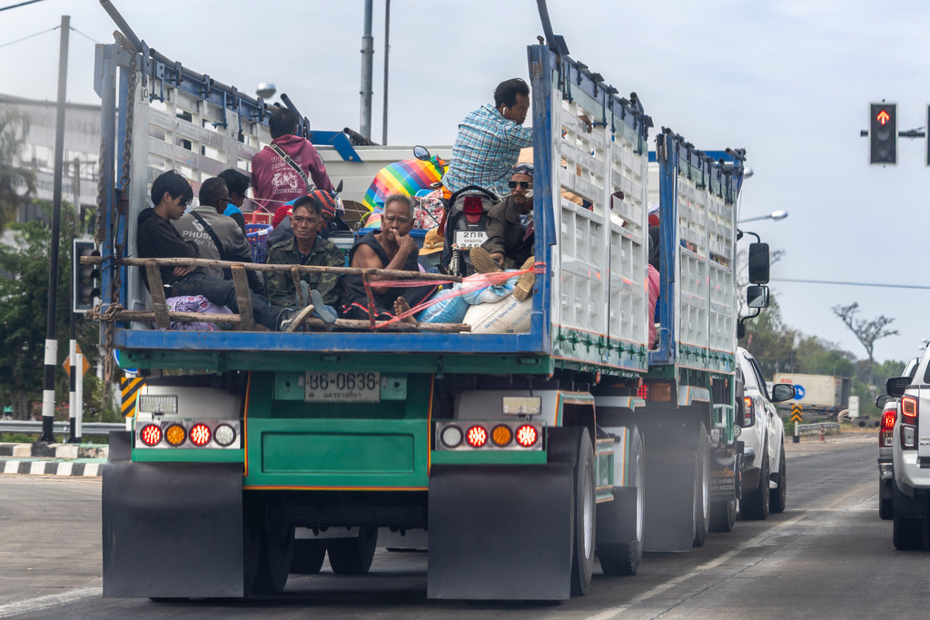 Thai residents who fled homes following the clashes between Thai and Cambodian soldiers, head to a shelter in Surin province, Thailand, Wednesday, Dec. 10, 2025. (AP Photo/Wason Wanichakorn)