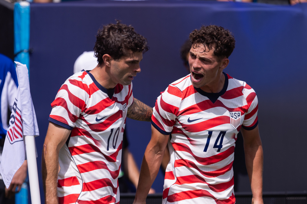 United States forward Christian Pulisic (10) celebrates with midfielder Sebastian Berhalter (14) after scoring in the first half against Senegal in an international friendly soccer match Sunday, May 31, 2026, in Charlotte, N.C. (AP Photo/Scott Kinser)
