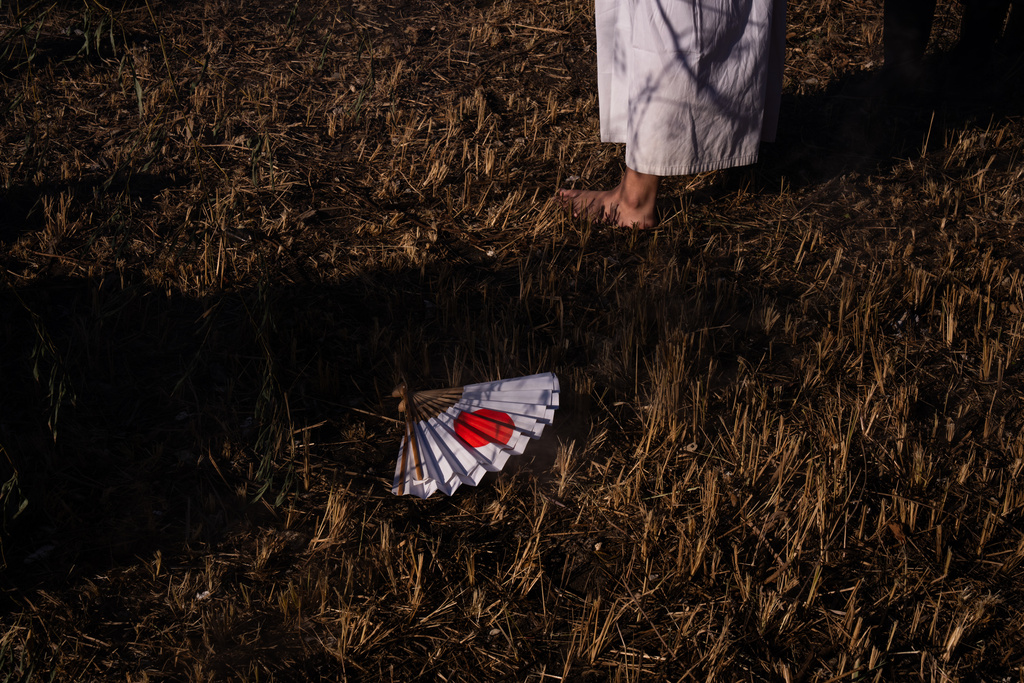 A participant during the Winter Sea Misogi Festival, a Shinto purification ritual marking the New Year, in Numazu, Japan, Monday, Jan. 12, 2026. (AP Photo/Louise Delmotte)