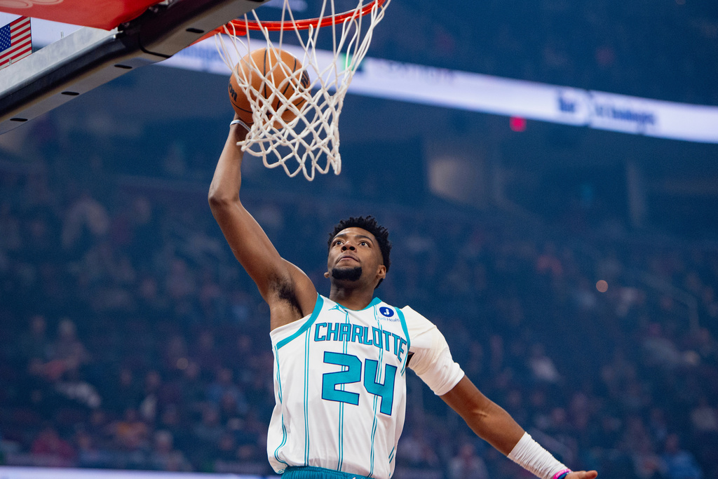 Charlotte Hornets' Brandon Miller (24) prepares to dunk against the Cleveland Cavaliers during the first half of an NBA basketball game, in Cleveland, Sunday, Dec. 14, 2025. (AP Photo/Phil Long)