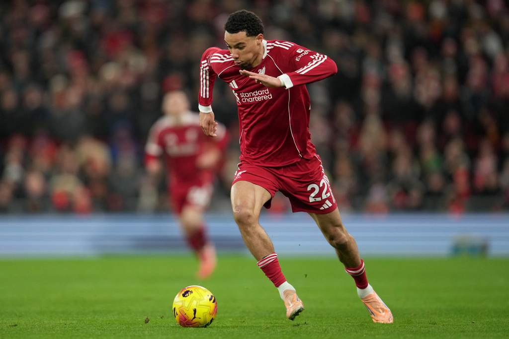 Liverpool's Hugo Ekitike controls the ball during the English Premier League soccer match between Liverpool and Leeds United in Liverpool, England, Thursday, Jan. 1, 2026. (AP Photo/Jon Super)