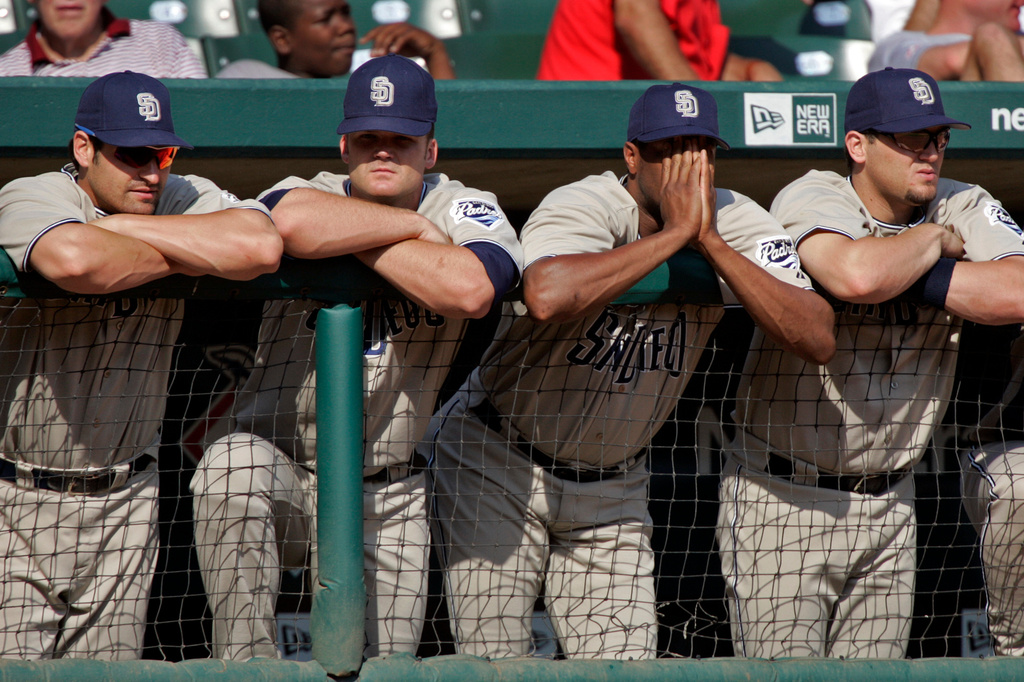 FILE - San Diego Padres players watch the end of Game One of the National League Division Series against the St. Louis Cardinals from the dugout rail in St. Louis, Oct. 4, 2005. (AP Photo/Mark Humphrey, File)