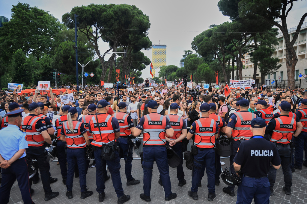 Police officers block a street during a demonstration in Tirana, Albania, Wednesday, June 3, 2026, opposing a luxury coastal development project linked to Jared Kushner and Ivanka Trump over concerns about environmental impacts and transparency.(AP Photo/Hameraldi Agolli)