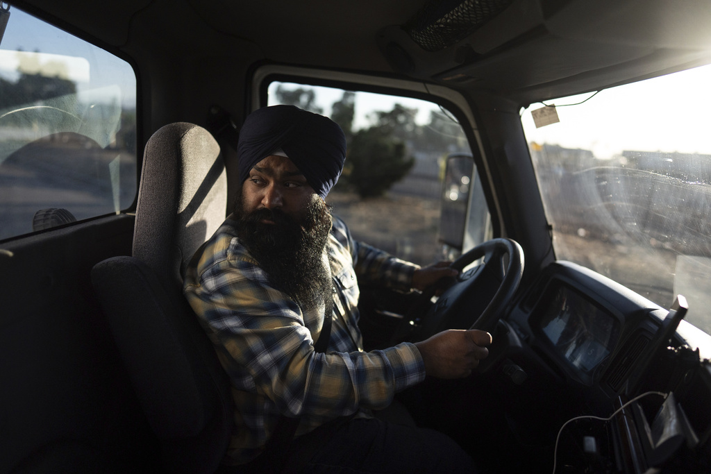 Sikh truck driver Prahb Singh maneuvers his truck at a gas station in Fontana, Calif., Wednesday, Sept. 3, 2025. (AP Photo/Jae C. Hong)
