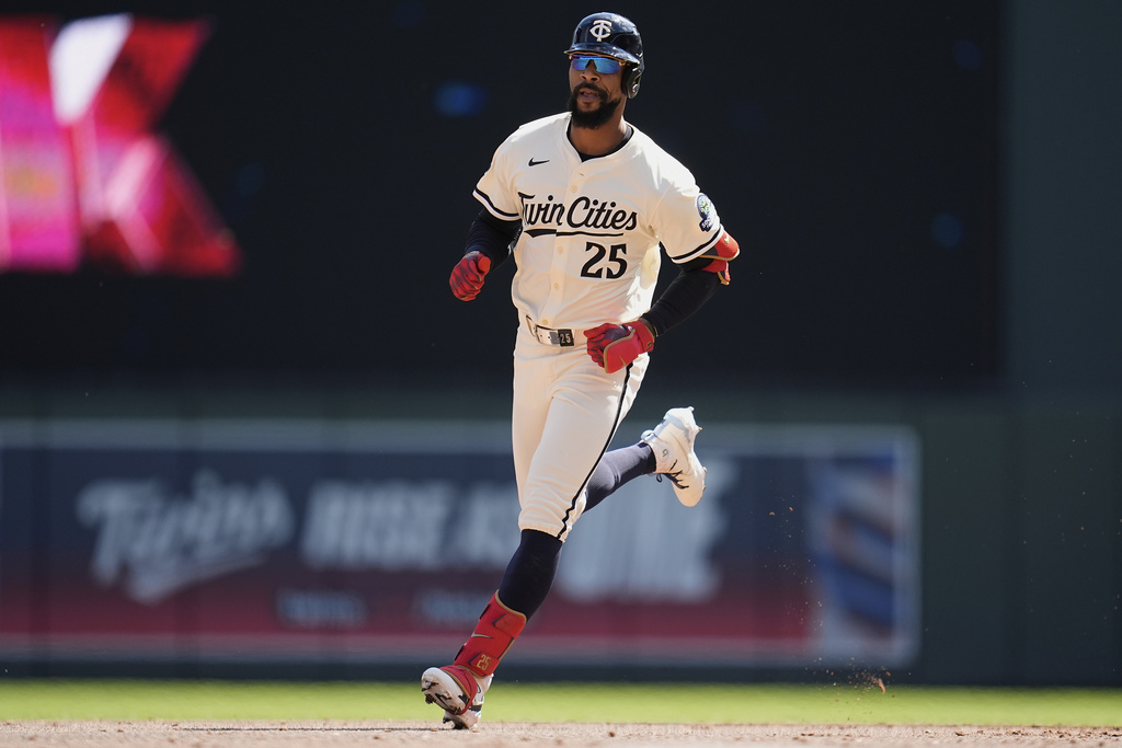 Minnesota Twins' Byron Buxton (25) runs the bases after hitting a two-run home run during the third inning of a baseball game against the San Diego Padres, Sunday, Aug. 31, 2025, in Minneapolis. (AP Photo/Abbie Parr)