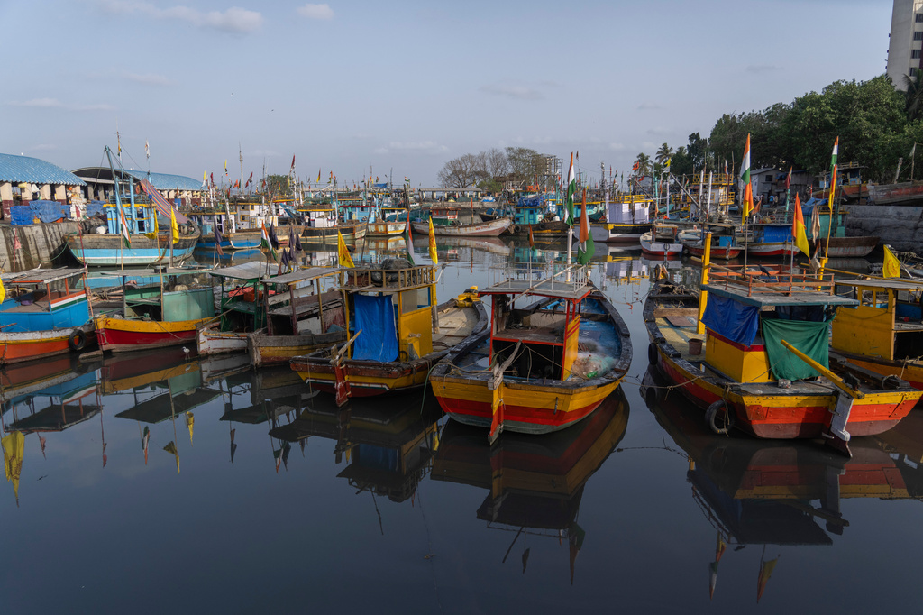 Small fishing boats are seen anchored at Sassoon Dock in Mumbai, India, Tuesday, April 7, 2026. (AP Photo/Rafiq Maqbool)