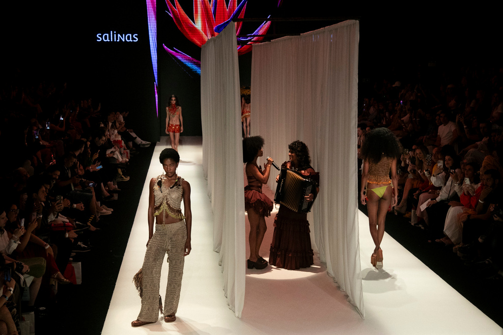 Models wear creations from the Salinas collection at the Pier Maua during the Rio Fashion Week in Rio de Janeiro, Wednesday, April 15, 2026. (AP Photo/Bruna Prado)