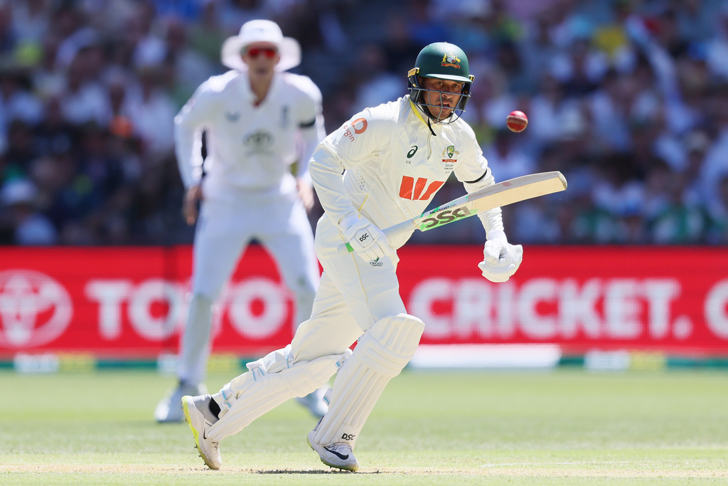 Australia's Usman Khawaja plays a shot during play on day one of the third Ashes cricket test between England and Australia at the Adelaide Oval in Adelaide, Australia, Wednesday, Dec. 17, 2025. (AP Photo/James Elsby)