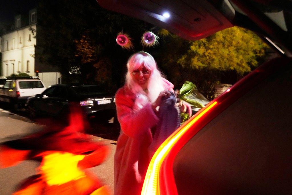 Young people dressed for a Halloween party in Warsaw, Poland, Friday, Oct. 31, 2025. (AP Photo/Czarek Sokolowski)