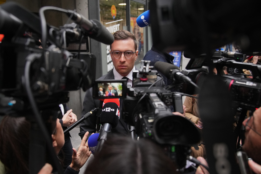 French far right National Rally party president Jordan Bardella answers reporters following a meeting, after France's prime minister Sebastien Lecornu resigned plunging the country into a deep political crisis. Monday, Oct. 6, 2025 in Paris. (AP Photo/Christophe Ena)