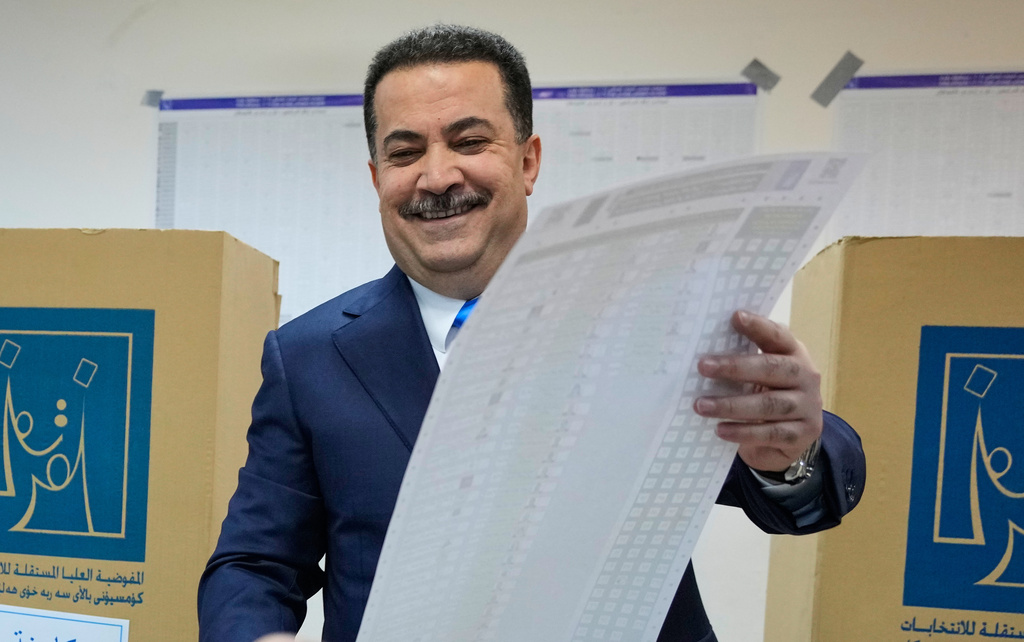 Iraqi Prime Minister Mohammed Shia al-Sudani casts his vote in the country's parliamentary election in Baghdad, Iraq, Tuesday, Nov. 11, 2025. (AP Photo/Hadi Mizban)
