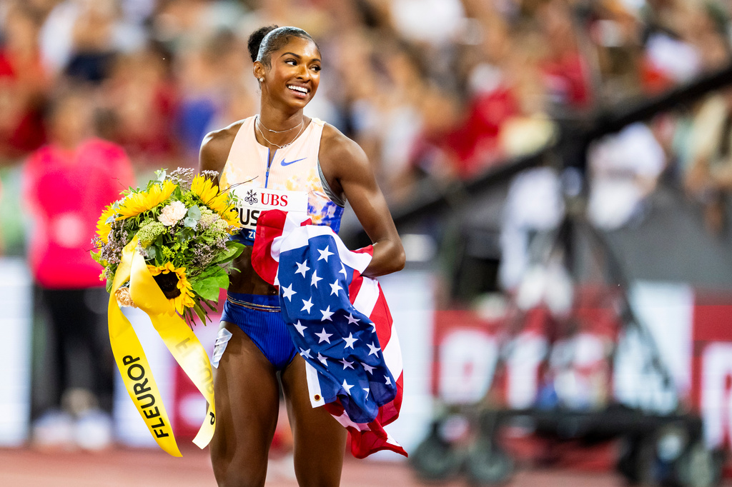United States' Masai Russell celebrates after winning the women's 100-meter hurdles race, setting a new world record, at the Diamond League athletics meeting, Thursday, Aug. 27, 2026, in Zurich, Switzerland. (Jean-Christophe Bott/Keystone via AP)