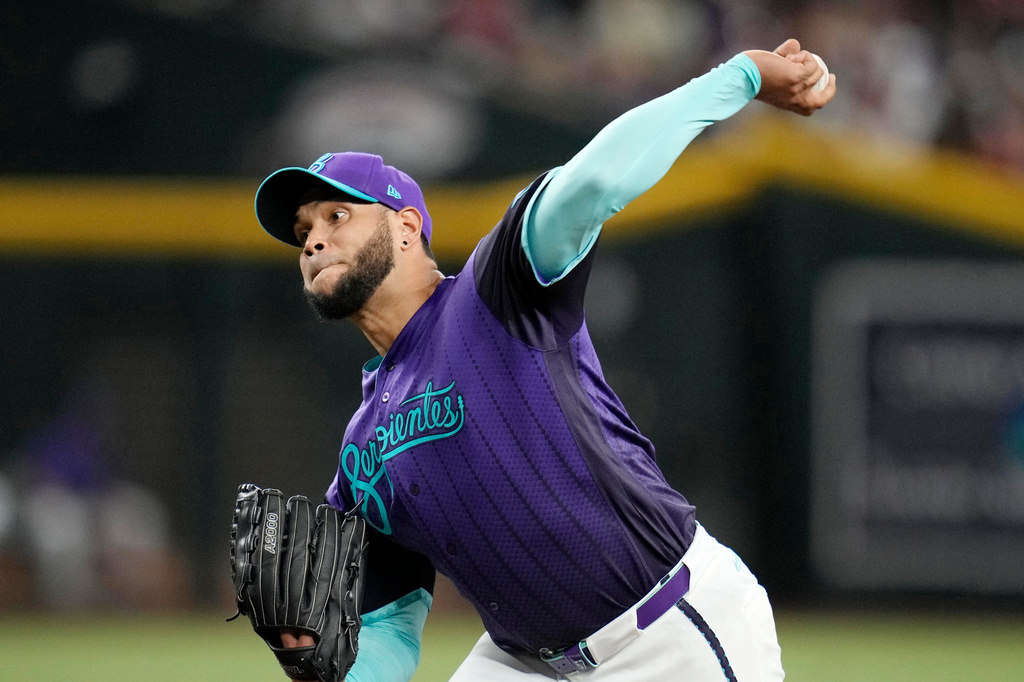 Arizona Diamondbacks starting pitcher Eduardo Rodriguez throws against the Cincinnati Reds during the first inning of a baseball game, Friday, Aug. 21, 2026, in Phoenix. (AP Photo/Ross D. Franklin)