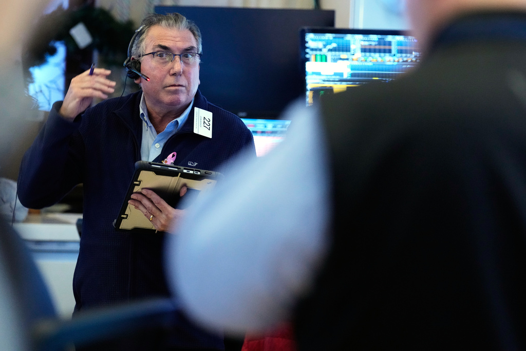 John Bishop works on the floor at the New York Stock Exchange in New York, Wednesday, Oct. 1, 2025. (AP Photo/Seth Wenig)