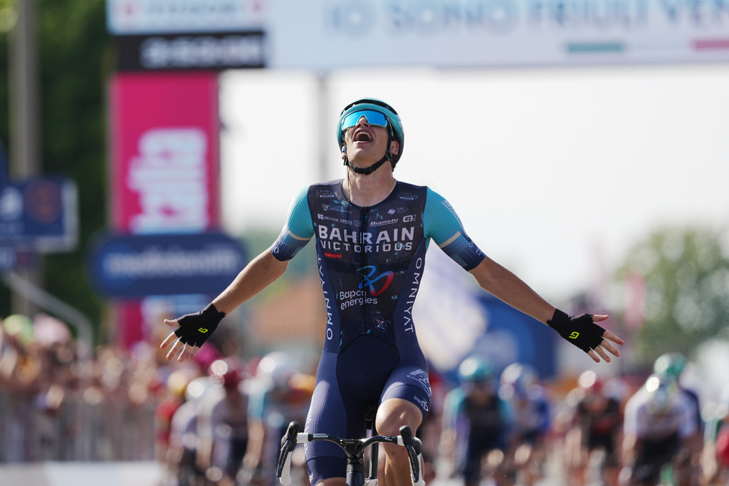 Belgium's Alec Segaert of Bahrain Victorious crosses the finish line to win the 12th stage of the Giro d'Italia cycling race, from Imperia to Novi Ligure, Italy, Thursday, May 21, 2026. (Massimo Paolone/LaPresse via AP)