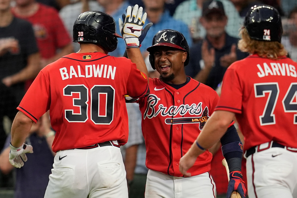 Atlanta Braves' Drake Baldwin (30) celebrates his three-run homer against the Texas Rangers in the fourth inning of a baseball game, Friday, July 17, 2026, in Atlanta. (AP Photo/Mike Stewart)