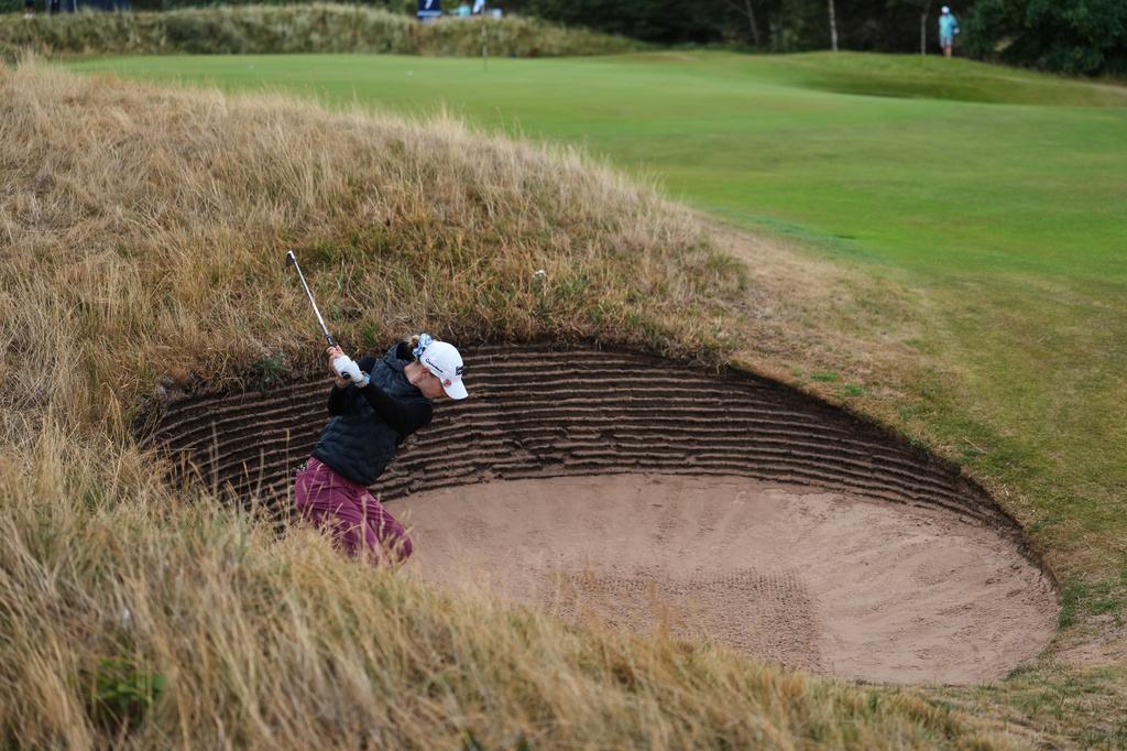 Nelly Korda, of the U.S. plays a shot out of a bunker on the 3rd hole during the first round of the Women's British Open golf championship in Lytham St Annes, England, Thursday, July 30, 2026. (AP Photo/Jon Super)