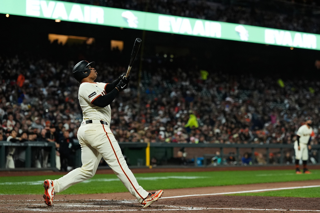 San Francisco Giants' Rafael Devers watches his sacrifice fly during the sixth inning of a baseball game against the San Diego Padres, Monday, May 4, 2026, in San Francisco. (AP Photo/Godofredo A. Vásquez)