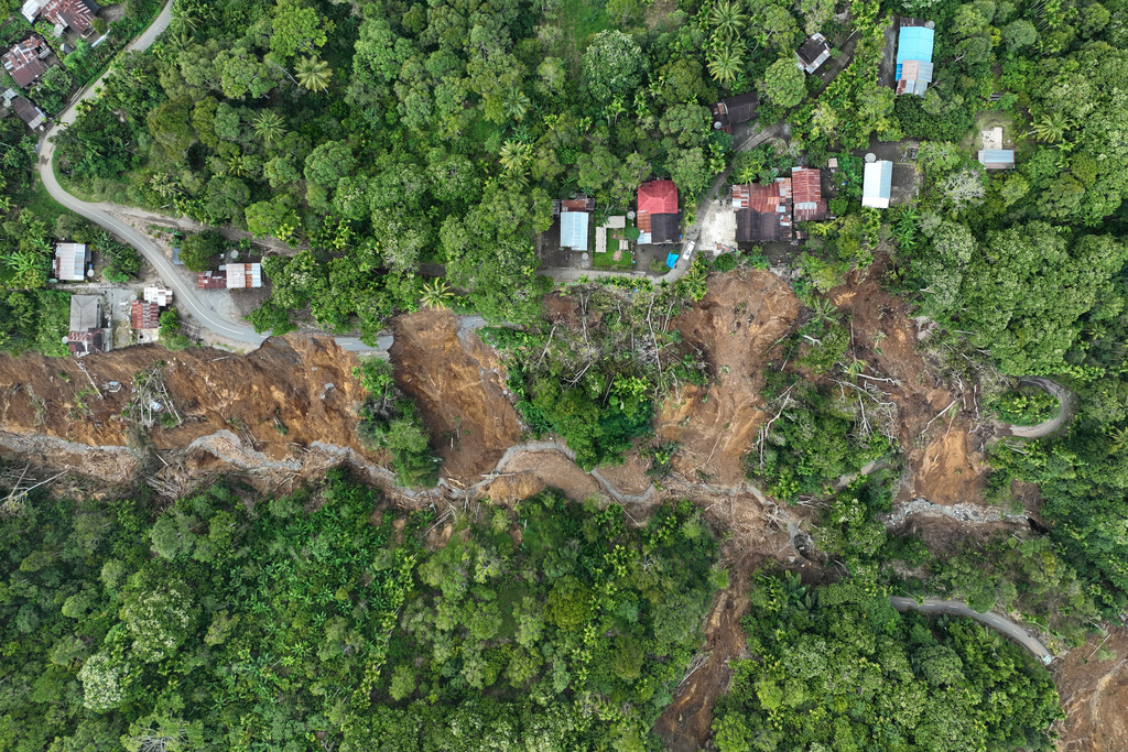 This aerial shot taken using a drone shows an area affected by landslides in Bener Meriah, Aceh province, Indonesia, Wednesday, Dec. 3, 2025. (AP Photo/Syahrul Rizal)