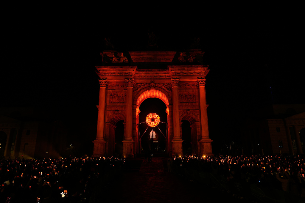 Italian former skier Deborah Compagnoni and Italian former skier Alberto Tomba light the cauldron at the Arco della Pace during the Olympic opening ceremony at the 2026 Winter Olympics, in Milan, Italy, Friday, Feb. 6, 2026. (AP Photo/Loaner12)