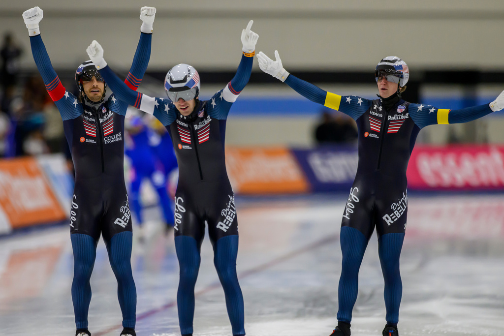 FILE - From left to right, United States' Emery Lehman, Casey Dawson and Ethan Cepuran celebrate after their new world record in the men's team pursuit at a World Cup speedskating event, Nov. 16, 2025, in Salt Lake City. (AP Photo/Tyler Tate, File)