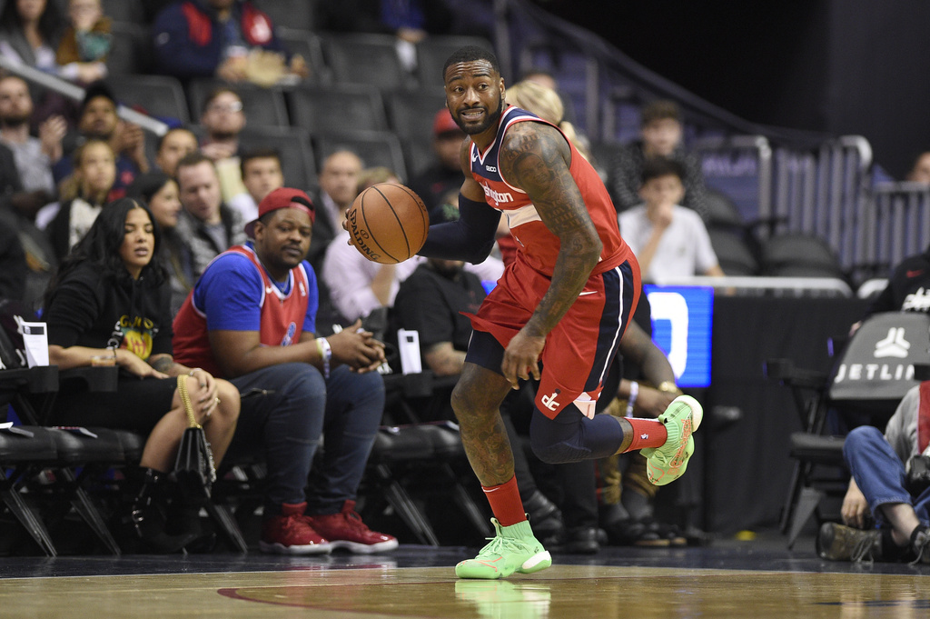 FILE - Washington Wizards guard John Wall (2) dribbles the ball during the first half of an NBA basketball game against the Brooklyn Nets, Saturday, Dec. 1, 2018, in Washington. (AP Photo/Nick Wass, File)
