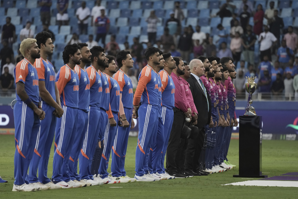 India's players and United Arab Emirates players stand for their national anthem during the Asia Cup Cricket match between United Arab Emirates and India at Dubai International Cricket stadium in Dubai, United Arab Emirates, Wednesday, Sept. 10, 2025. (AP Photo/Fatima Shbair)