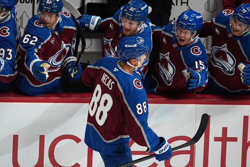 Colorado Avalanche center Martin Necas is congratulated as he passes the team box after scoring a goal against the New Jersey Devils in the first period of an NHL hockey game Tuesday, Oct. 28, 2025, in Denver. (AP Photo/David Zalubowski) Colorado Avalanche center Martin Necas is congratulated as he passes the team box after scoring a goal against the New Jersey Devils in the first period of an NHL hockey game Tuesday, Oct. 28, 2025, in Denver. (AP Photo/David Zalubowski)