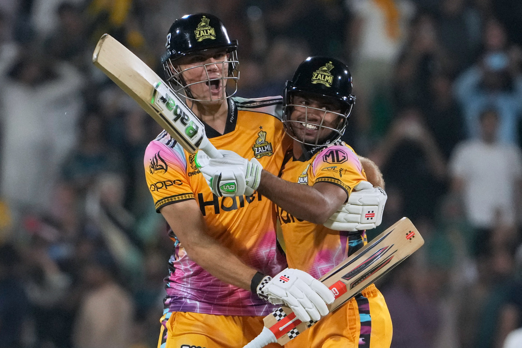 Peshawar Zalmi's Aaron Hardie, left, celebrates with Farhan Yousuf after winning the Pakistan Super League final cricket match against Hyderabad Kingsmen, in Lahore, Pakistan, Sunday, May 3, 2026. (AP Photo/K.M. Chaudary)