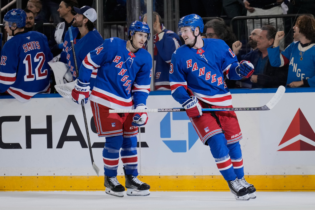 New York Rangers' Alexis Lafreni&egrave;re, right, celebrates his second goal of the night during the first period of an NHL hockey game against the Tampa Bay Lightning in New York, Tuesday, Oct. 13, 2026. (AP Photo/Seth Wenig)