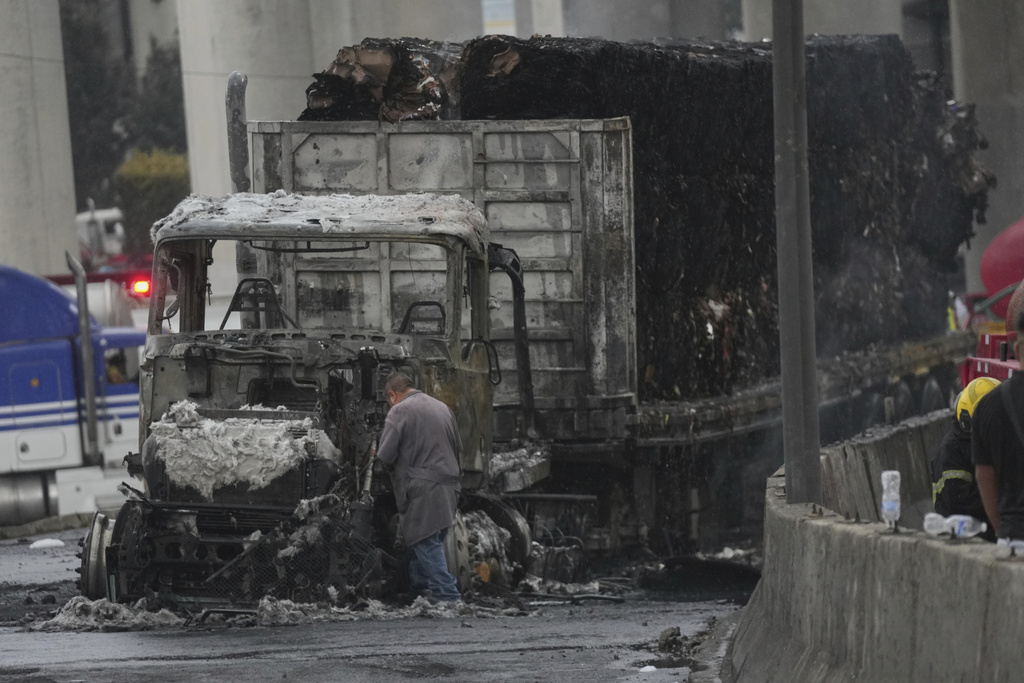A damaged truck sits on a road following a gas tanker explosion in Mexico City, Wednesday, Sept. 10, 2025. (AP Photo/Fernando Llano)
