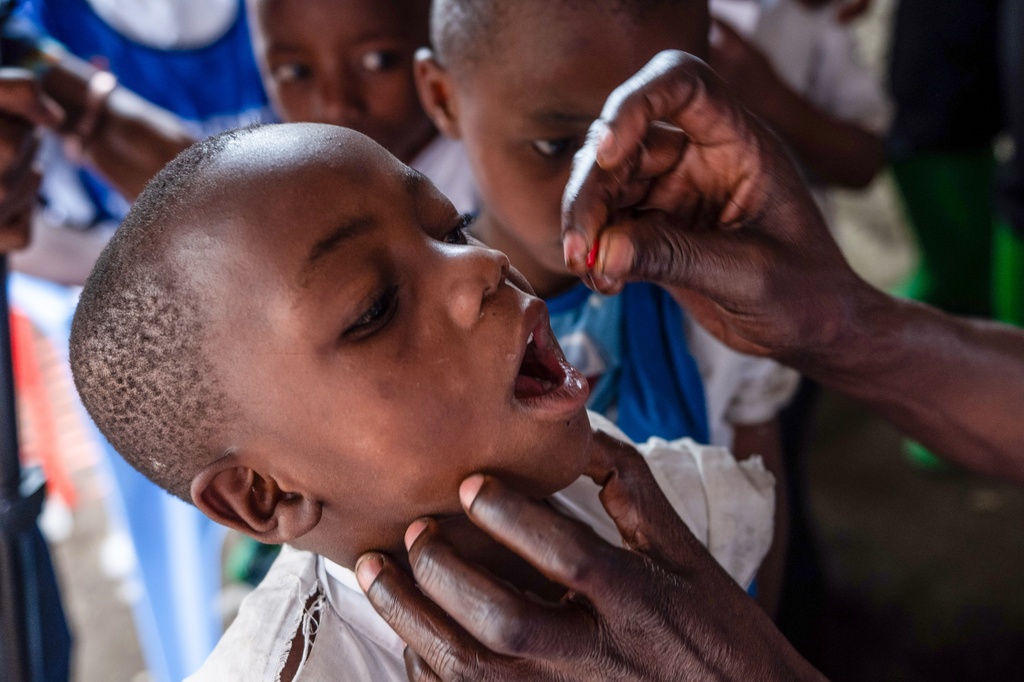 A school child receives a measles vaccination at the Kachehembe health center in Rubaya, eastern Democratic Republic of Congo, Monday, Dec. 1, 2025. (AP Photo/Moses Sawasawa)