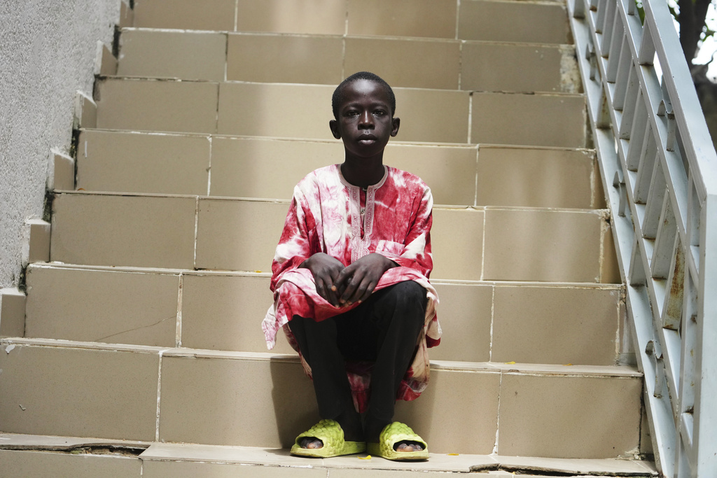 Israel Peter, who fled his village following an attack by Boko Haram Islamic extremists, waits to be interviewed by The Associated Press, at the Future Prowess Islamic Foundation School in Maiduguri, Nigeria, Thursday, July 24, 2025. (AP Photo/Sunday Alamba)