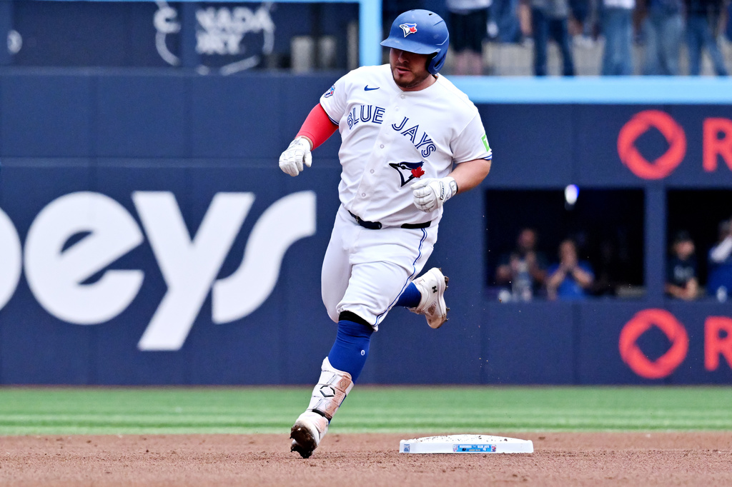 Toronto Blue Jays' Alejandro Kirk runs the bases after hitting a two-run home run against the Seattle Mariners during the first inning of a baseball game in Toronto, Sunday, Aug. 30, 2026. (Jon Blacker/The Canadian Press via AP)