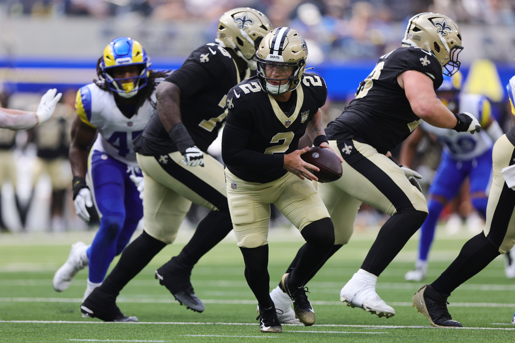 New Orleans Saints quarterback Spencer Rattler (2) rolls out of the pocket during the second half of an NFL preseason football game against the Los Angeles Rams Saturday, Aug. 22, 2026, in Inglewood, Calif. (AP Photo/Ryan Sun)